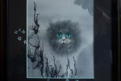 Katze in Höhle, gerahmt
